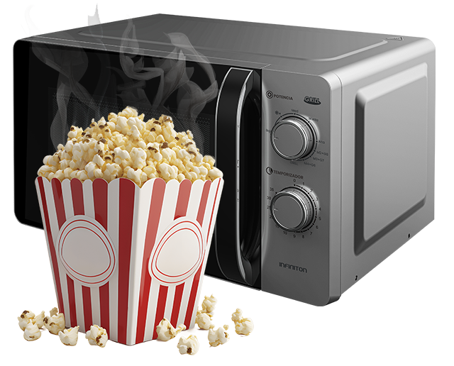 Microondas de fondo, con un paquete de palomitas delante